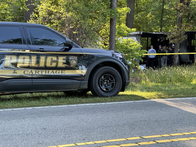 Investigators looking for clues to what started a fatal mobile home fire. | Photo: Patrick Priest