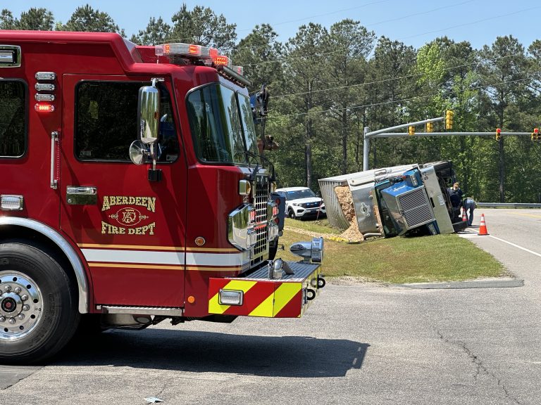 Overturned semi-truck’s cargo removed before being turned upright