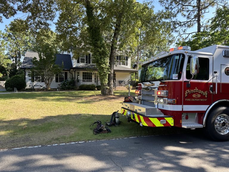 Pinehurst fire contained to porch, dog on the loose