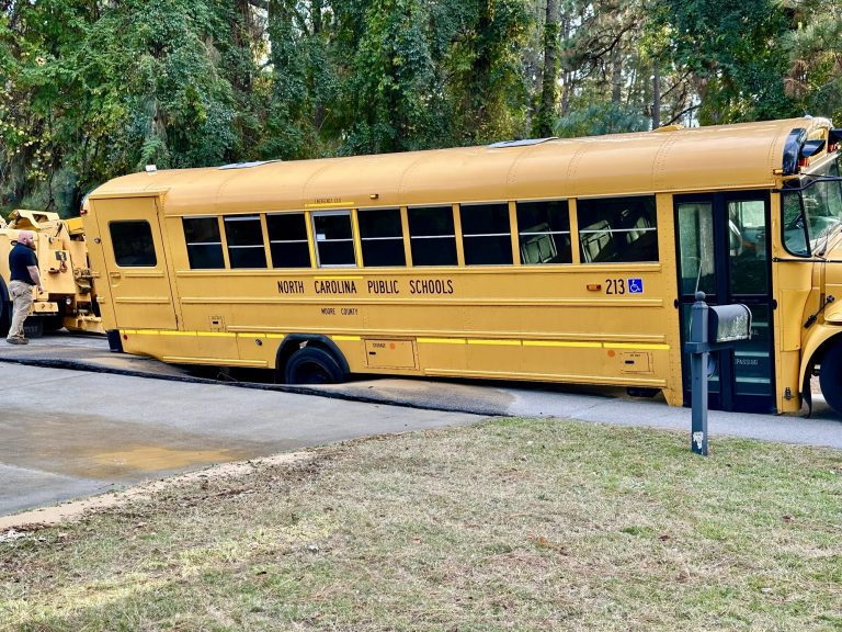 School bus partially falls into sinkhole, students evacuate unharmed