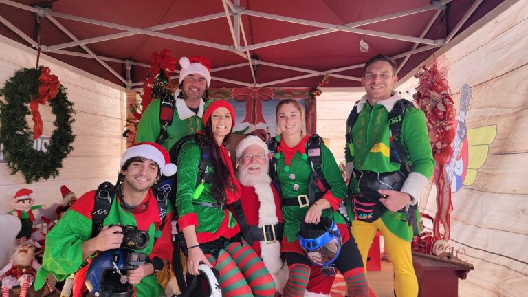 Santa and his skydiving elves returning to Pik-n-Pig