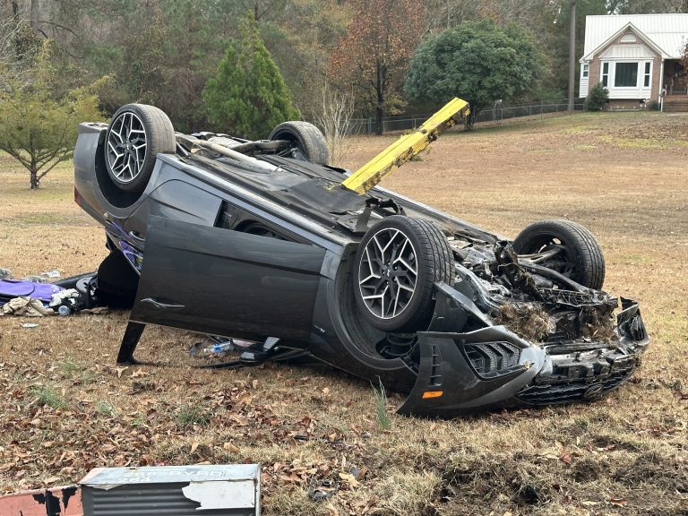Mailbox post penetrated through car in rollover crash