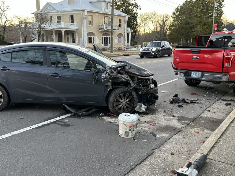 Driver hits parked car, taken to hospital