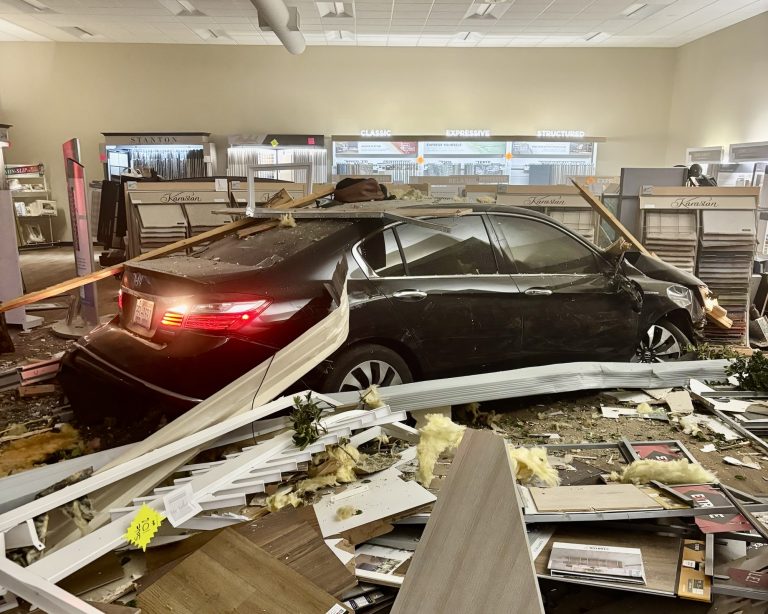 Car slams into Vass carpet store after dramatic crash on U.S. 1