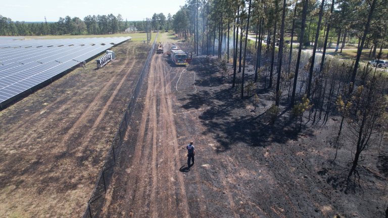 Wind-driven fire breaches solar farm fence along Hoffman Road