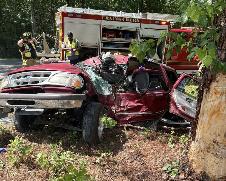 Crews cut car open to rescue trapped driver in crash near Cameron