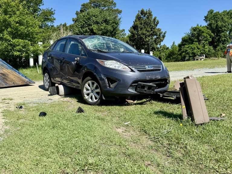 Car flips on Lobelia Road, driver uninjured