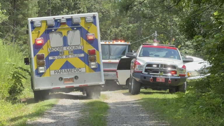 Ambulance rushes shooting victim from scene to a nearby landing zone. (Patrick Priest)