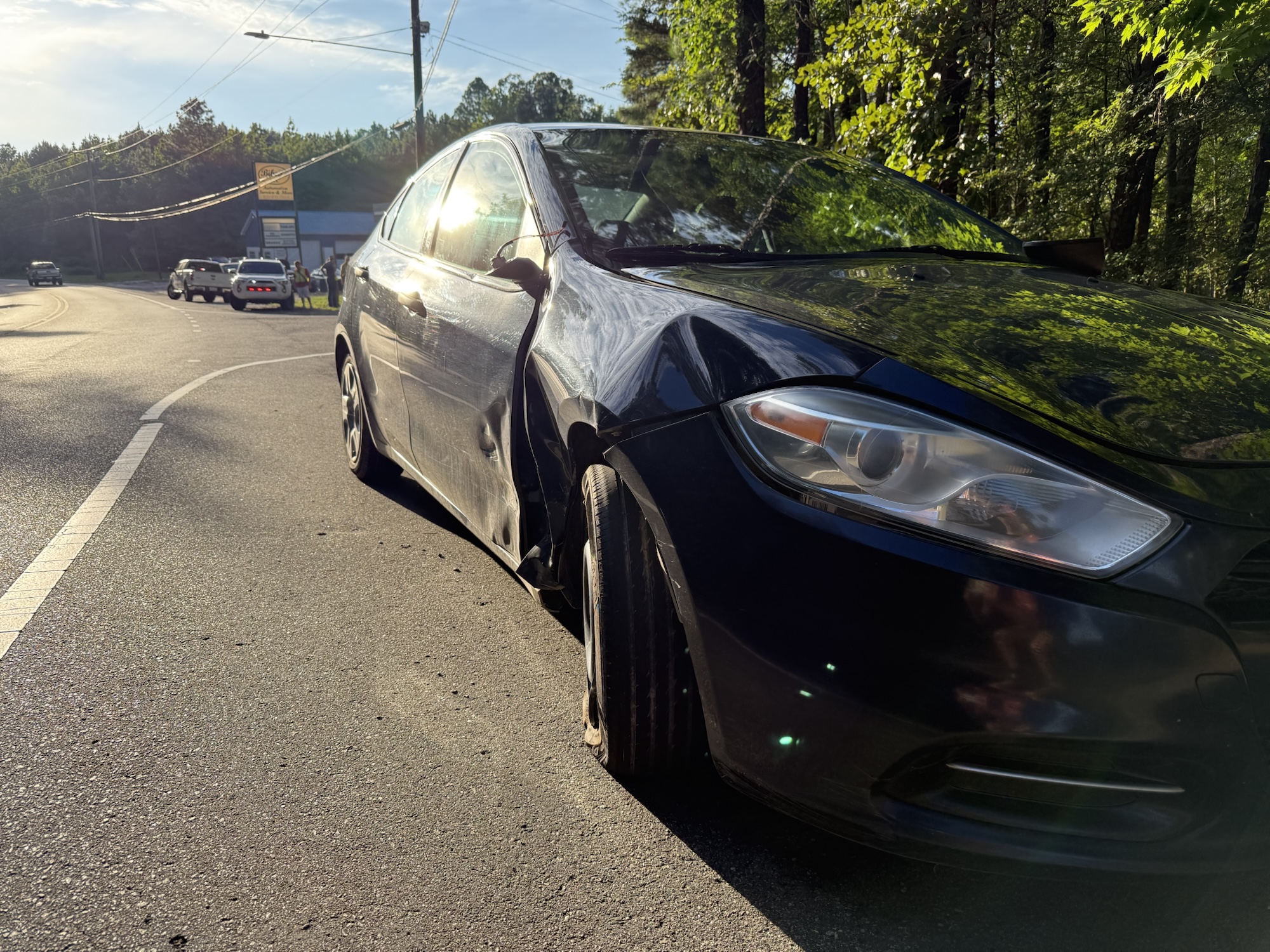 Dodge Dart with damage sustained in crash with motorcycle. (Patrick Priest)
